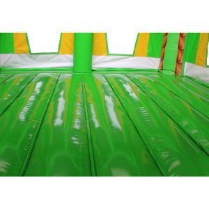 Green and yellow bouncy castle jumping area.