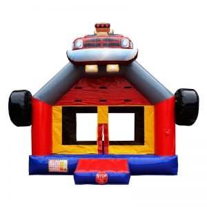 Monster Truck bounce house front view. Blue red and yellow inflatable with a monster truck 3D design mounted on top.